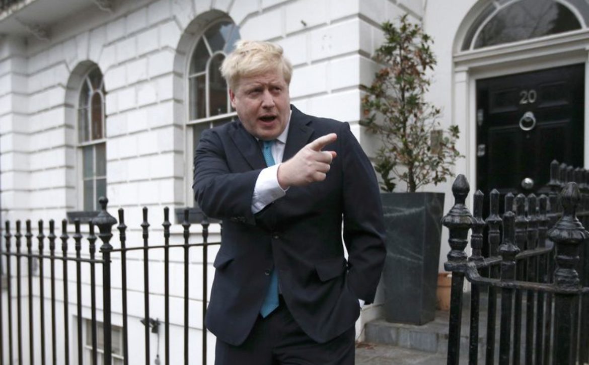 London Mayor Boris Johnson prepares to speak to the media in front of his home in London